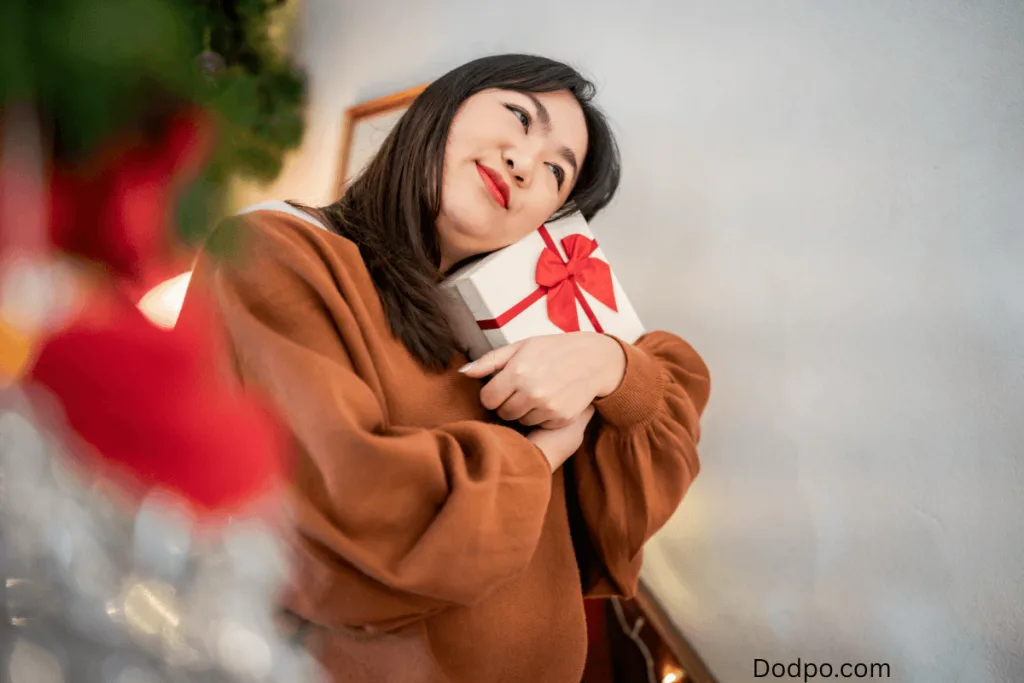 a woman holding a personalized gifts
