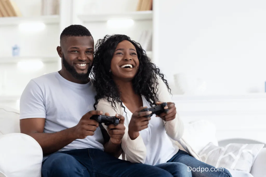 Couple playing video game in a date at home