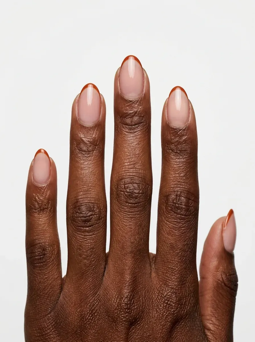 Short almond nails with ultra-thin burnt orange micro French tips