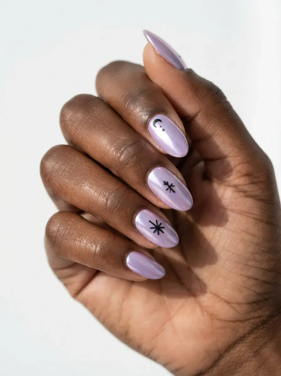 Lavender chrome nails with matte black graphic details on deep chestnut skin