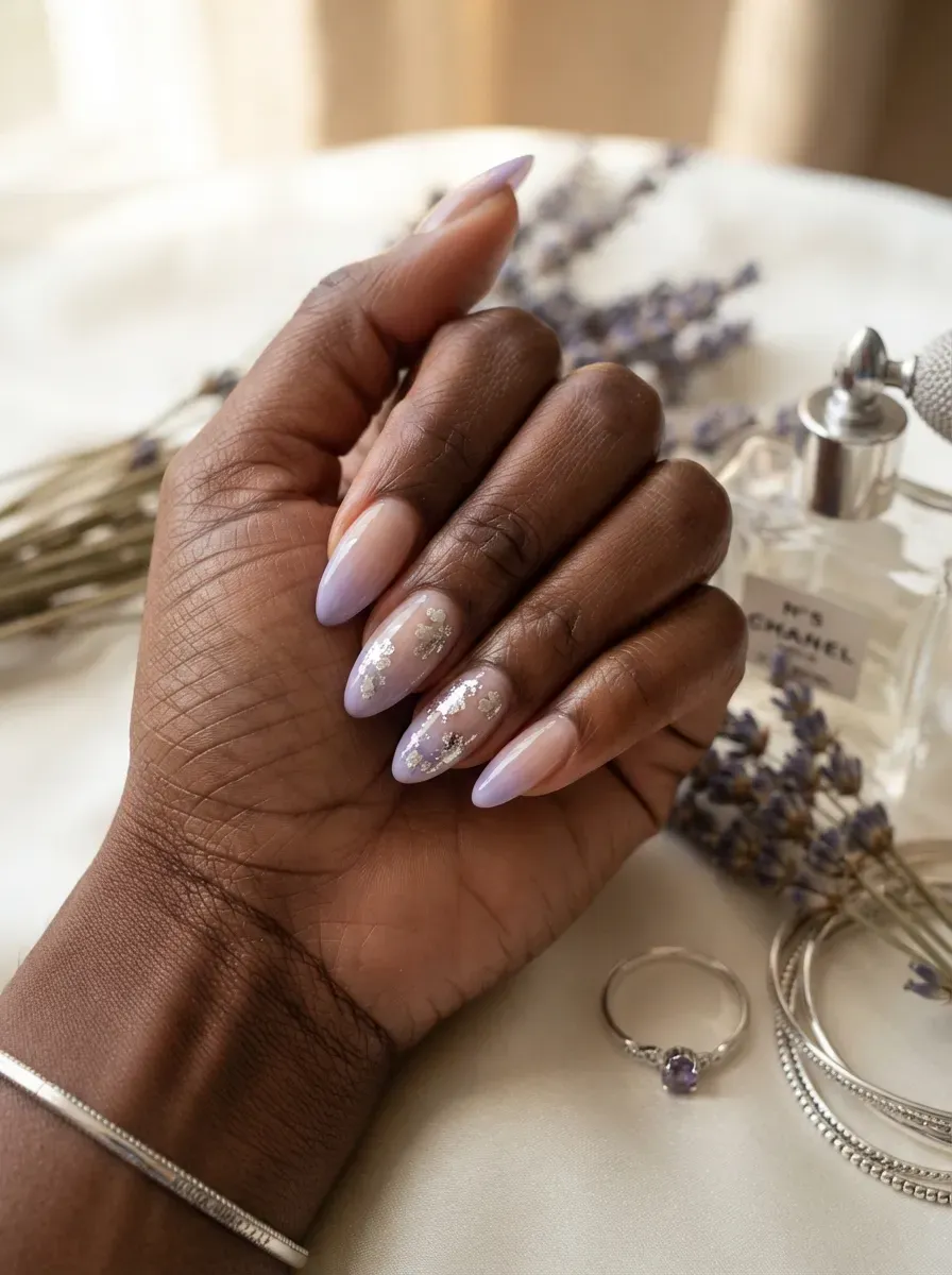 Lavender French fade nails with fine metallic floral foil accent details