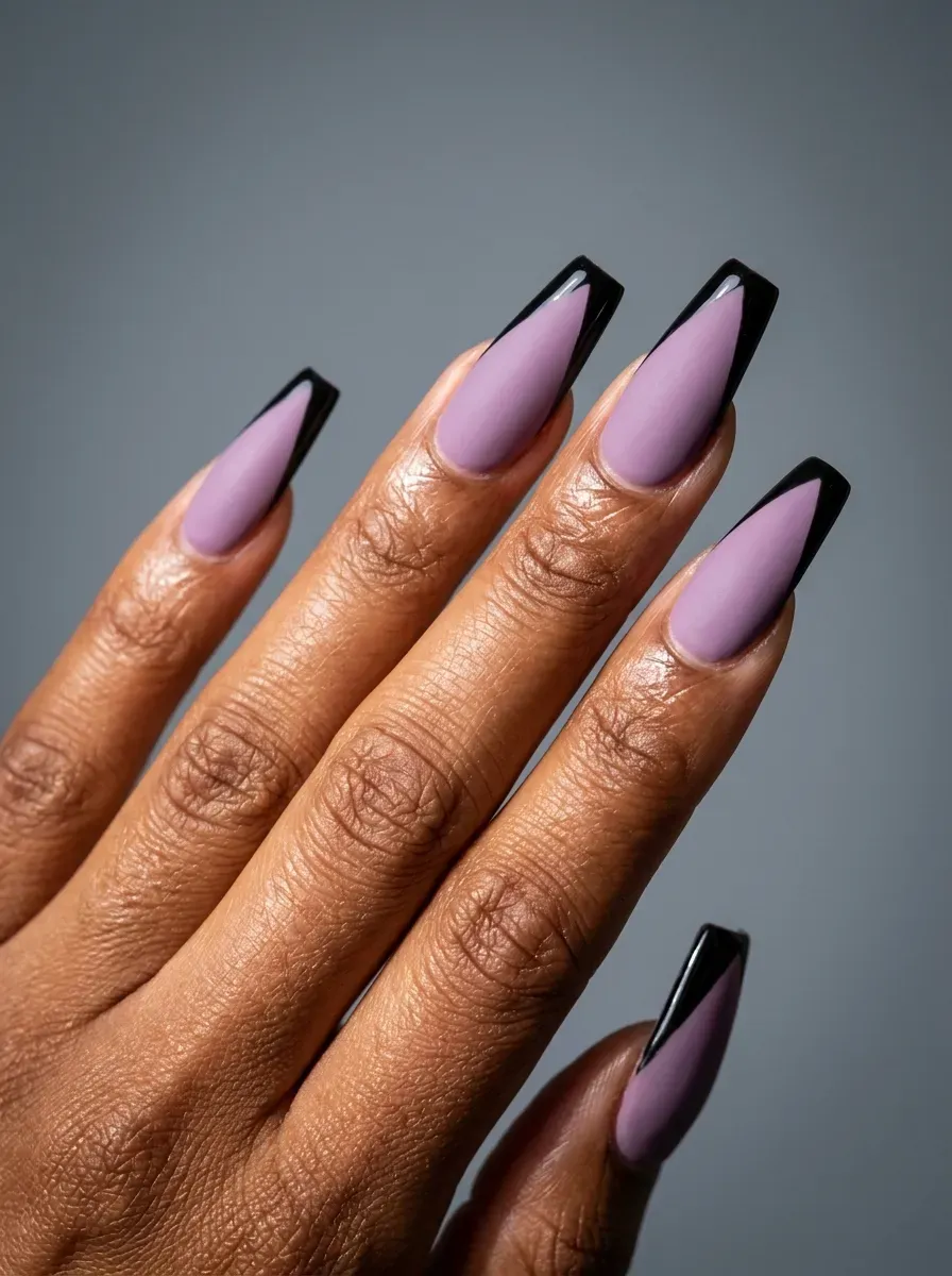 Long coffin nails with matte lavender bases and glossy black tips
