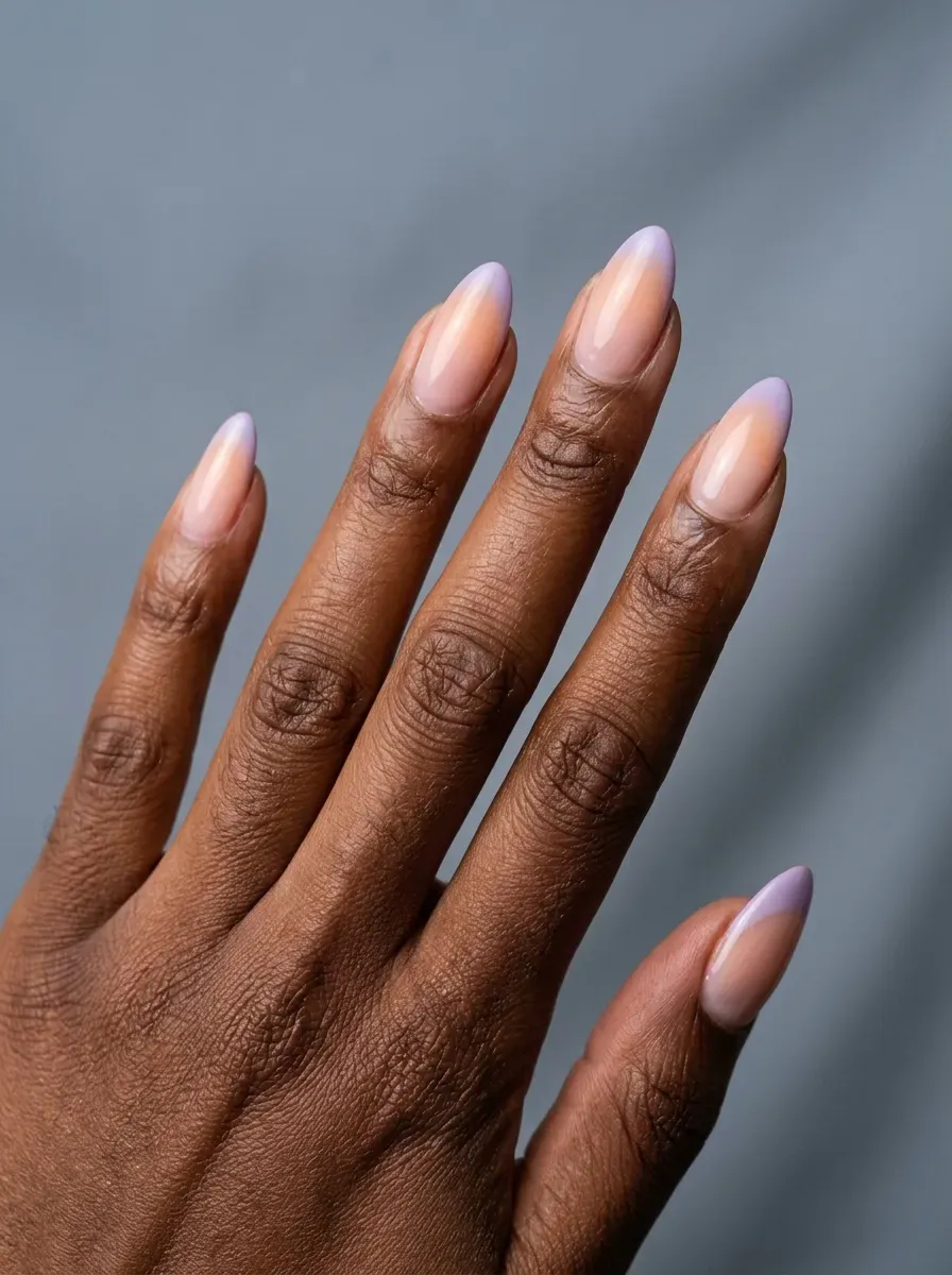 Medium almond nails with pastel purple peach gradient French tips