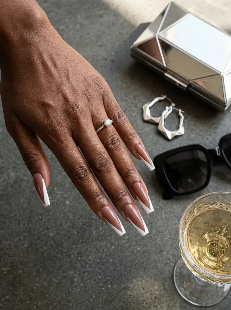 Long coffin nails with sharp white V shaped French tips