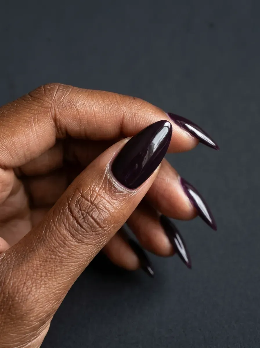 Golden olive shimmer nails with subtle reflective finish on brown skin