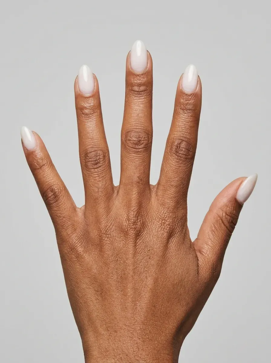 Short almond gel nails with translucent milky white glossy polish