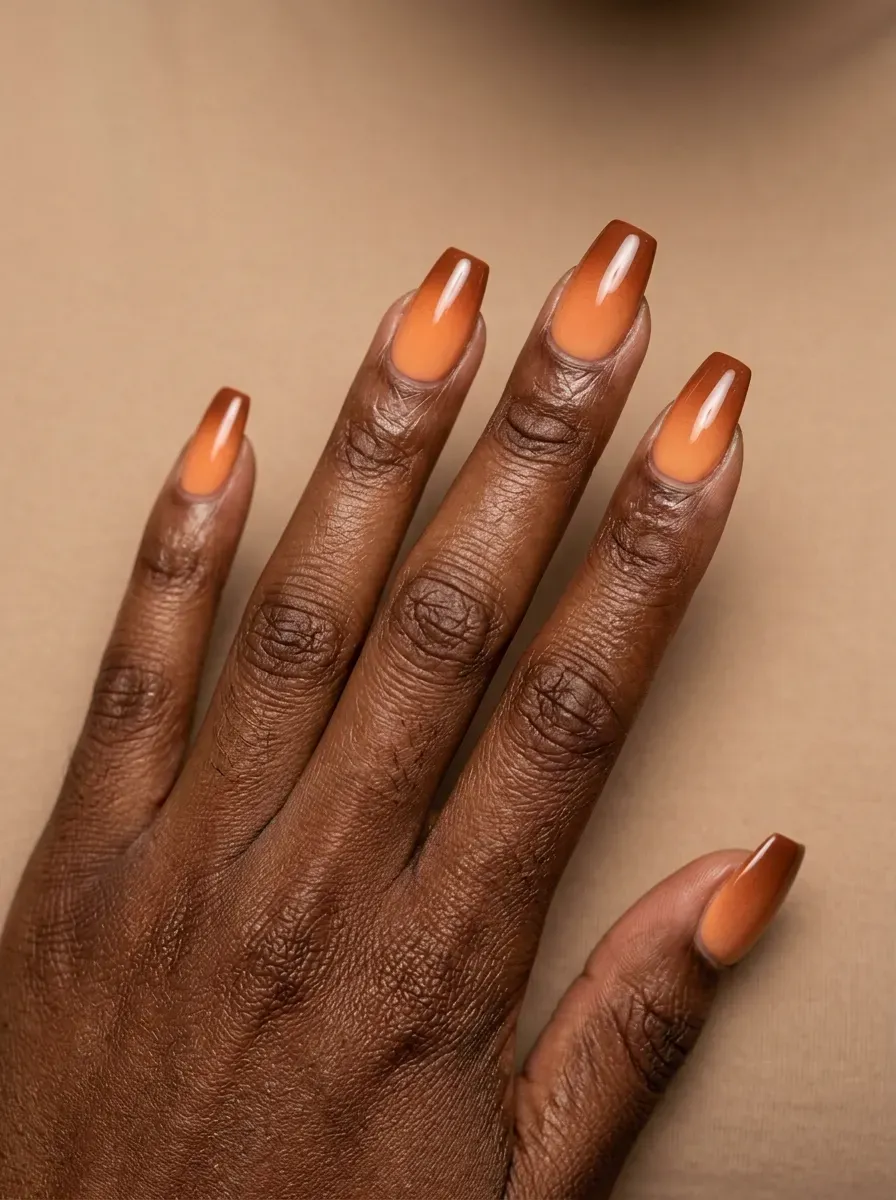 Pumpkin spice gradient nails blending orange and brown tones