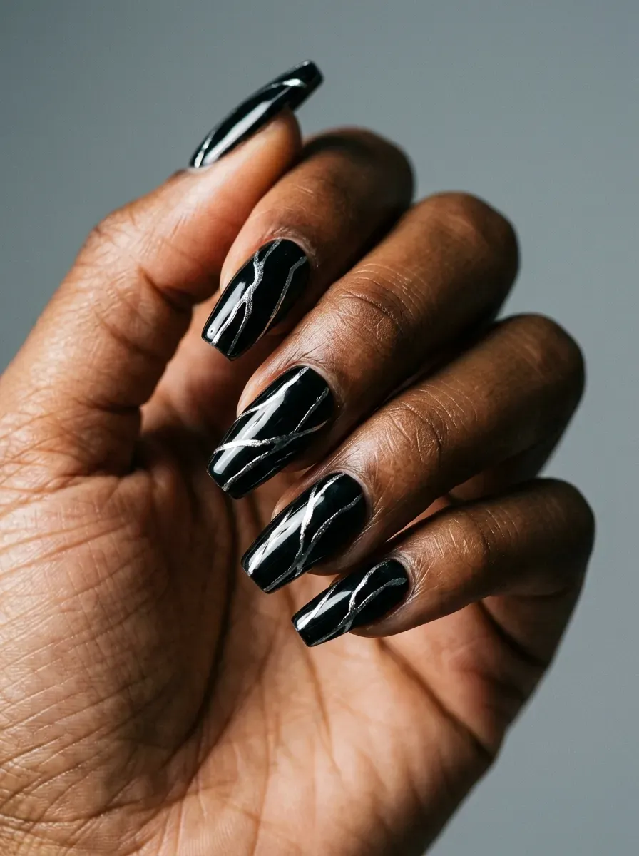 Glossy black coffin nails with thin silver scratch-like graphic lines