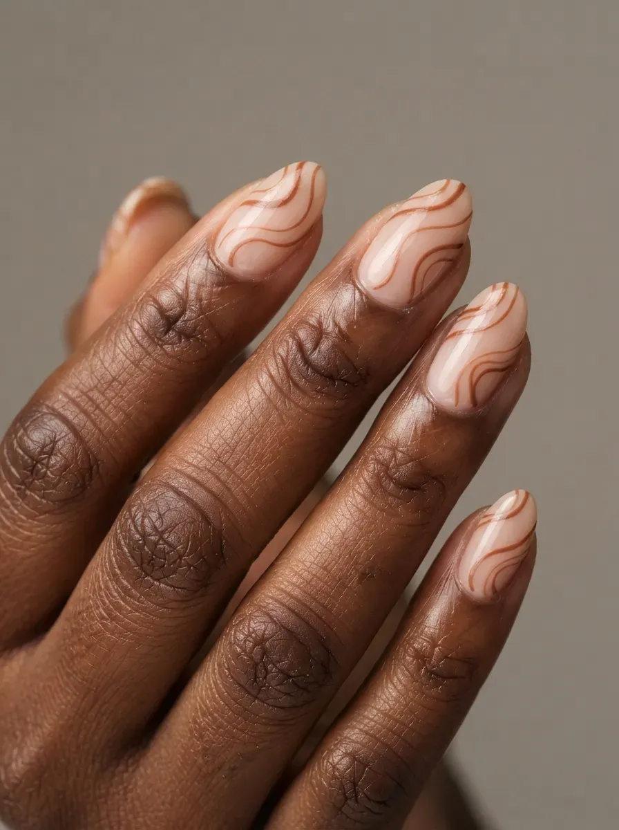 Short square nails with burgundy side French tips on deep brown skin