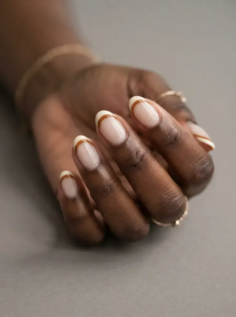 Short almond nails with cream and caramel layered French tip bands