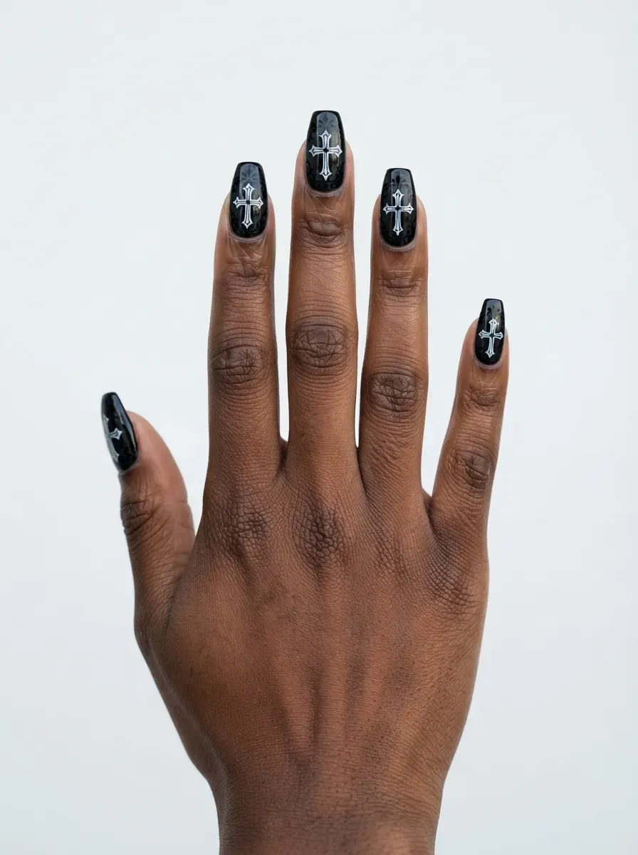 Close-up of pink coffin nails with black crackle polish effect